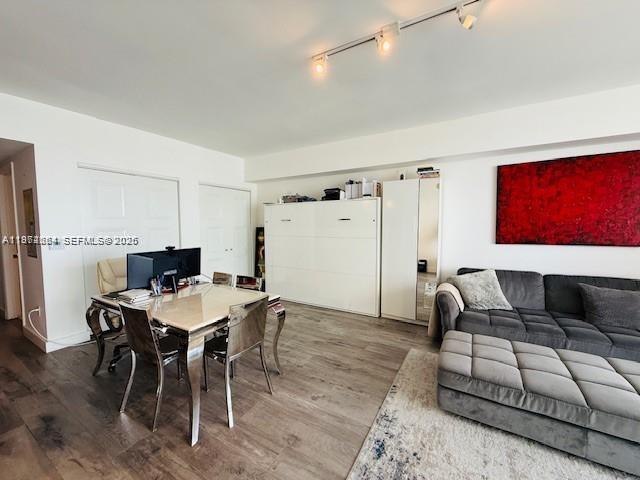 475 Brickell Avenue, Unit 4910 Miami, FL 33131 - Photo 7 of 25 a living room with furniture a rug and a table