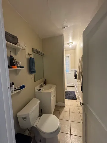 a bathroom with a toilet a sink and bathtub