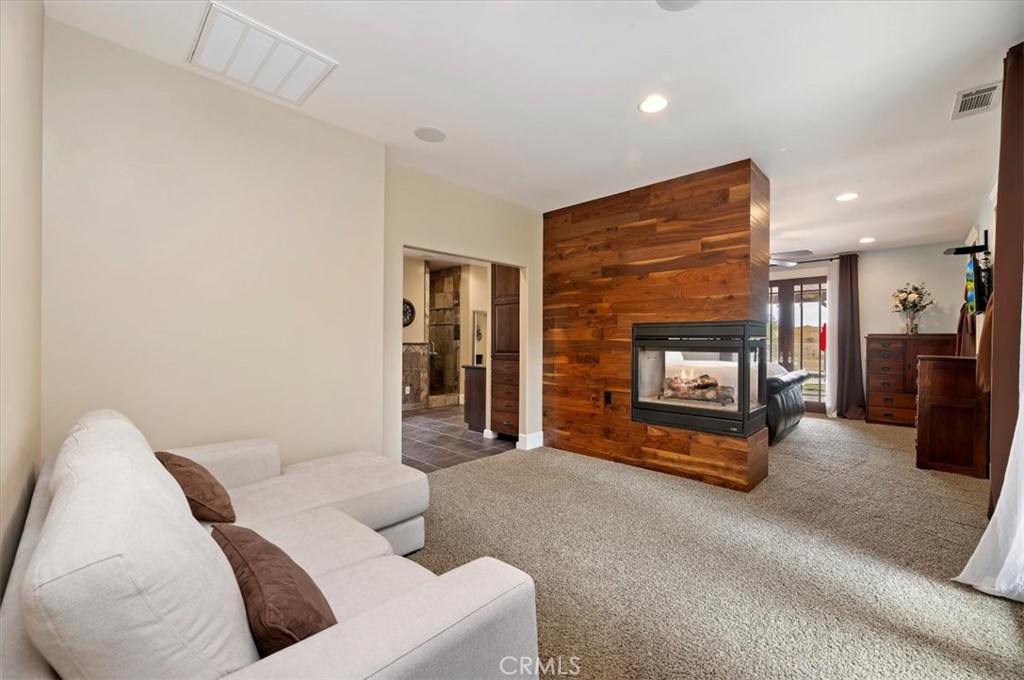 16420 Rocky Glen Road Perris, CA 92570 - Photo 27 of 74 a living room with furniture and a fireplace