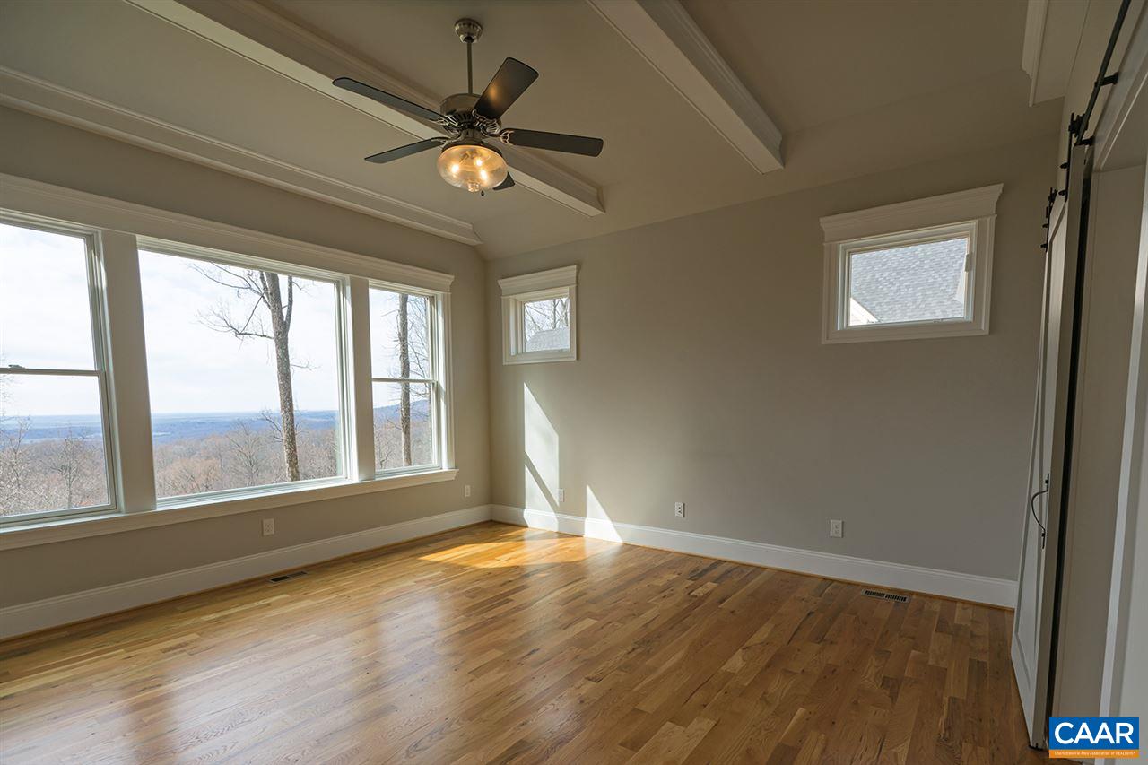 2492 Summit Ridge Trail Charlottesville, VA 22911 - Photo 20 of 50 a view of an empty room with wooden floor and a window