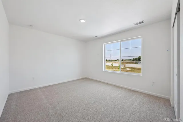 a view of an empty room and window