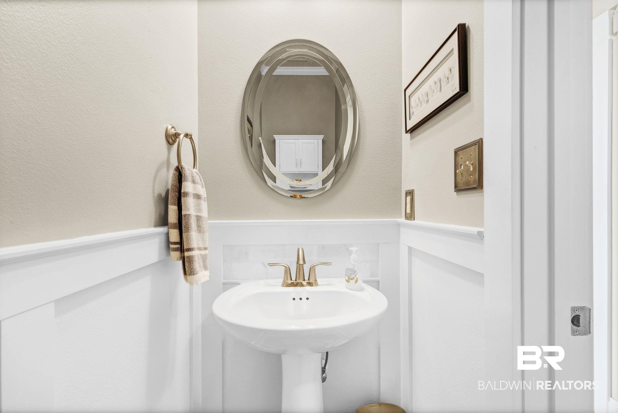 20105 Bunker Loop Fairhope, AL 36532 - Photo 43 of 65 Half Bath featuring a wainscoted wall