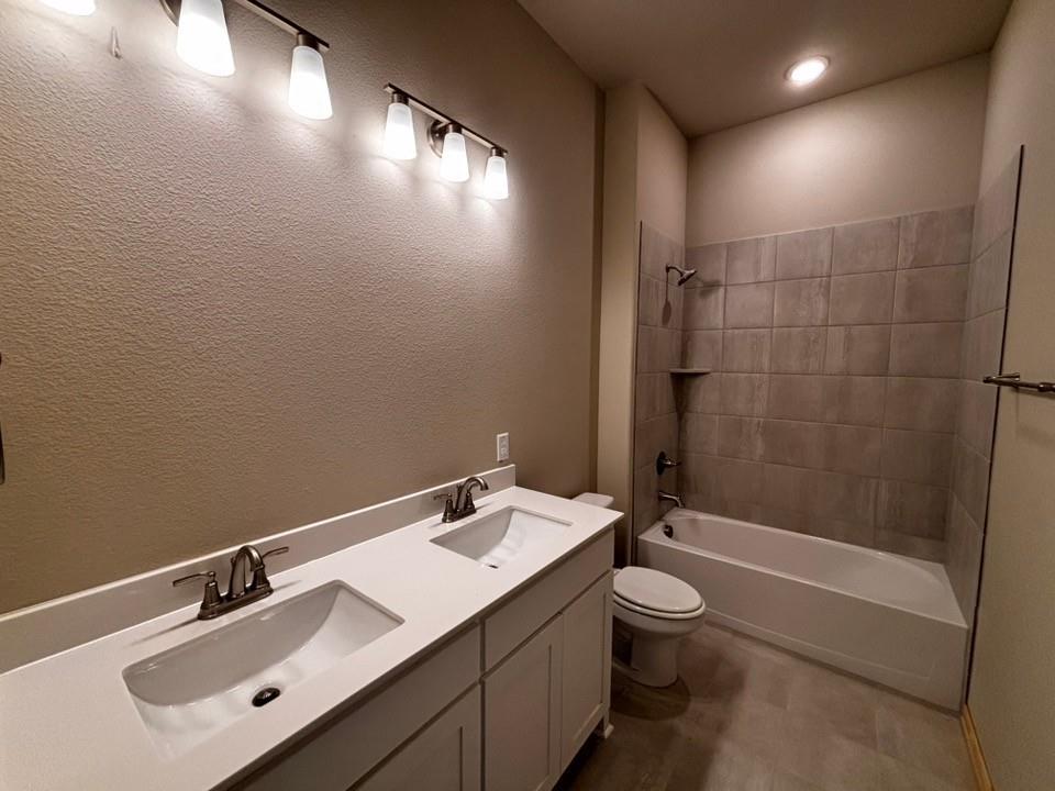 157 Big Sky Road Decatur, TX 76234 - Photo 12 of 13 Dual vanity with integrated sinks and white countertops