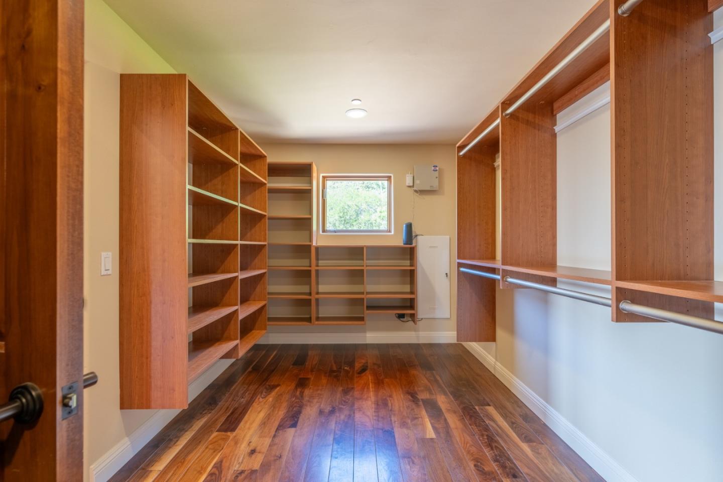 67 Tucker Road Watsonville, CA 95076 - Photo 16 of 32 a view of walk in closet with wooden floor and window