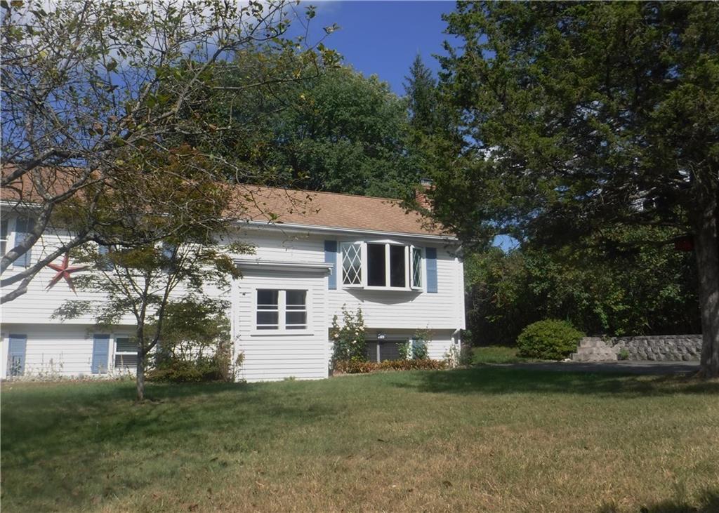 20 Stonecastle Road New Milford, CT 06776 - Photo 1 of 1 a front view of a house with a garden