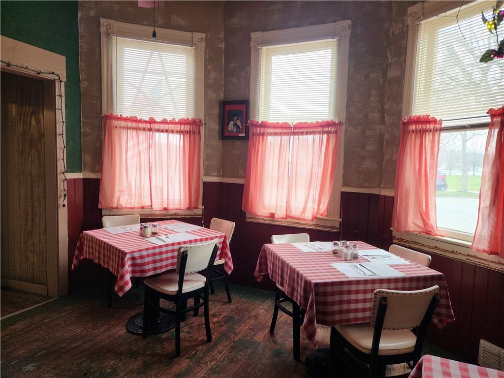 331 West Main Street Ligonier, PA 15658 - Photo 2 of 9 a room that has a bed and a table in it