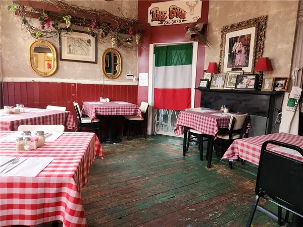 a kitchen with stainless steel appliances kitchen island granite countertop a sink and cabinets
