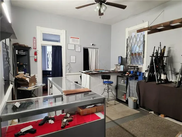 a bedroom with furniture and a flat screen tv