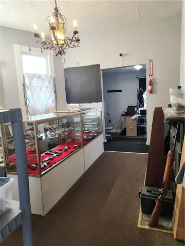 a bedroom with a bed and a flat tv screen on the table