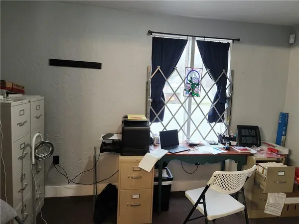 a view of furniture and a fireplace