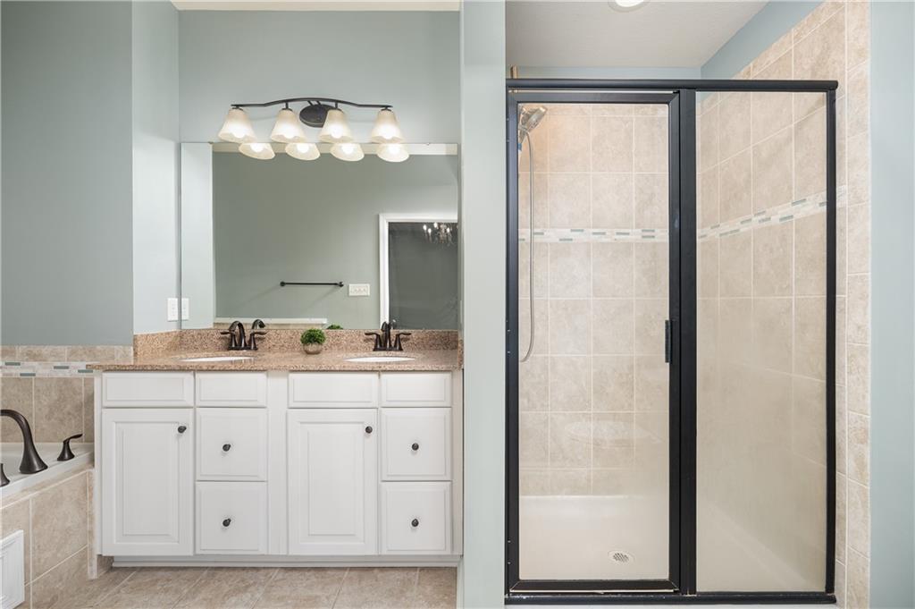 203 Ledge Rock Lane Mars, PA 16046 - Photo 13 of 33 a bathroom with a double vanity sink and a mirror