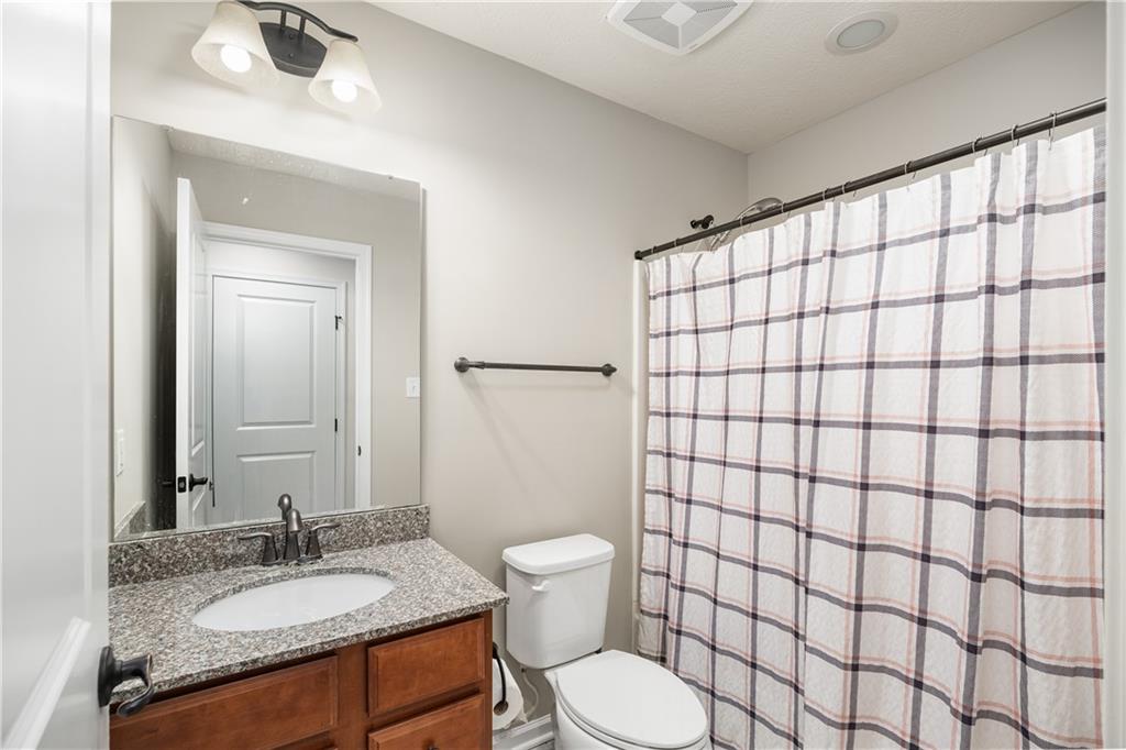 203 Ledge Rock Lane Mars, PA 16046 - Photo 16 of 33 a bathroom with a granite countertop sink toilet and shower