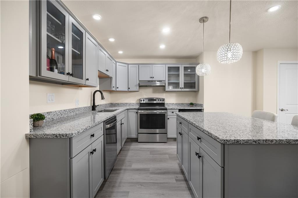 203 Ledge Rock Lane Mars, PA 16046 - Photo 24 of 33 a kitchen with stainless steel appliances granite countertop a sink stove and cabinets