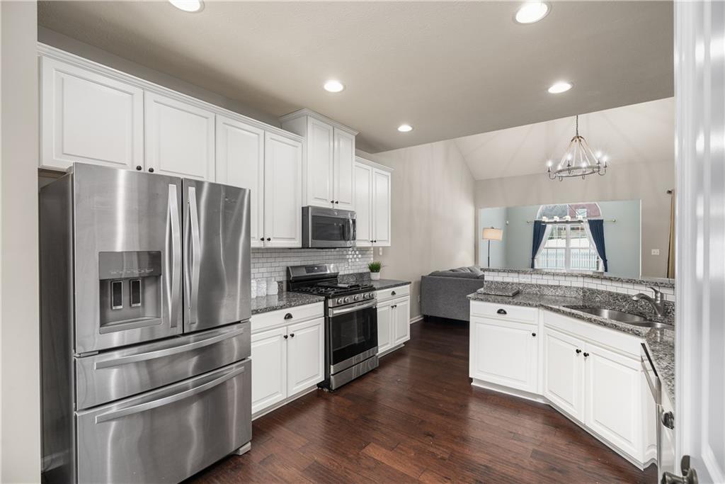 203 Ledge Rock Lane Mars, PA 16046 - Photo 4 of 33 a kitchen with stainless steel appliances a refrigerator sink and microwave