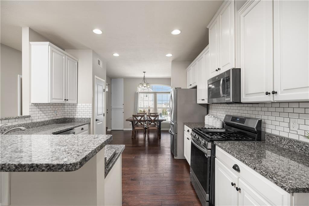 203 Ledge Rock Lane Mars, PA 16046 - Photo 5 of 33 a kitchen with sink stove and cabinets