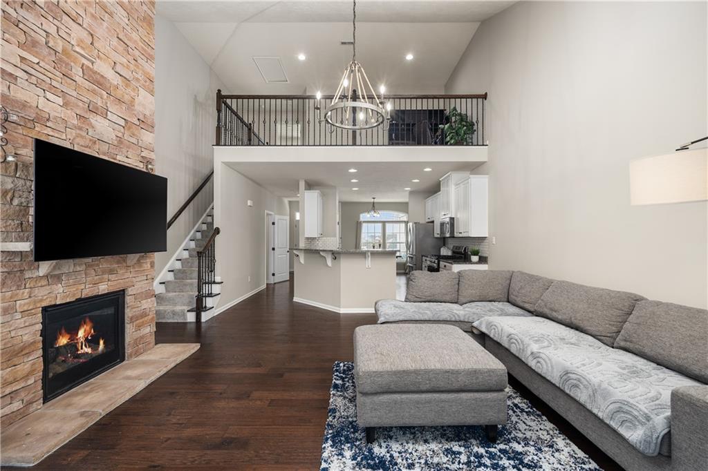 203 Ledge Rock Lane Mars, PA 16046 - Photo 9 of 33 a living room with furniture a flat screen tv and a fireplace