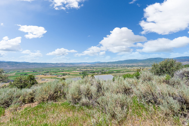 2459 Painter Road Marion, UT 84036 - Photo 16 of 42 Expansive landscape featuring distant mountains and a valley with agricultural fields