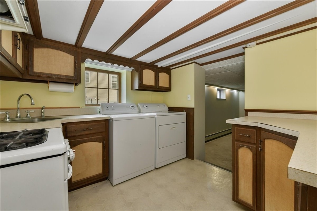 102 Border Street Dedham, MA 02026 - Photo 11 of 34 a utility room with dryer and washer