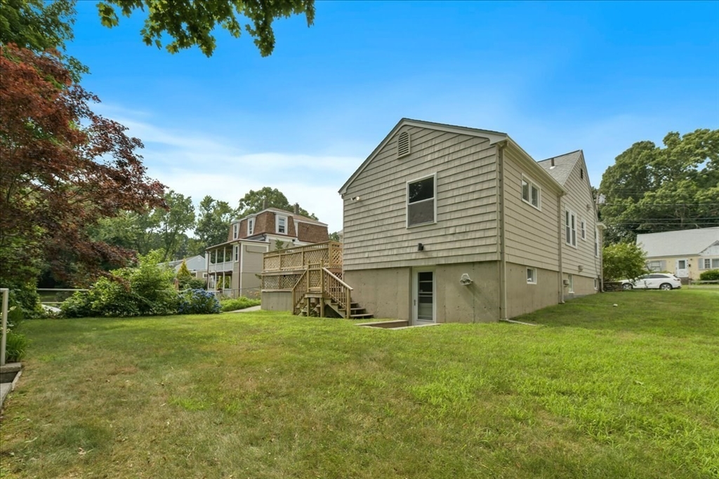 102 Border Street Dedham, MA 02026 - Photo 23 of 34 a view of a house with a yard