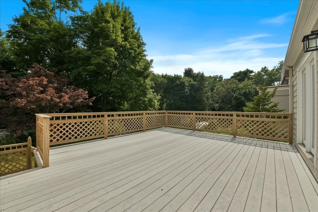 102 Border Street Dedham, MA 02026 - Photo 27 of 34 a view of deck with wooden floor and fence