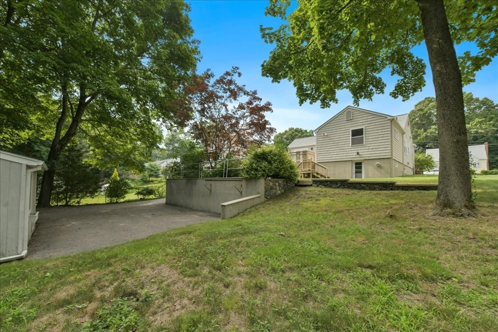 102 Border Street Dedham, MA 02026 - Photo 29 of 34 a view of a house with a yard
