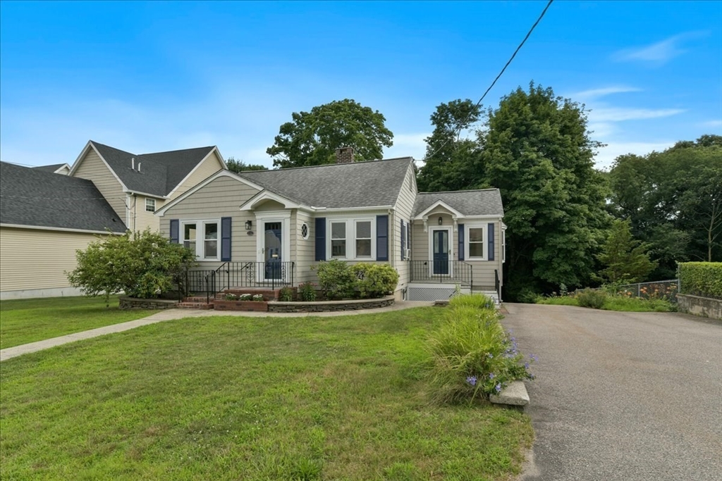 102 Border Street Dedham, MA 02026 - Photo 31 of 34 a front view of a house with a yard