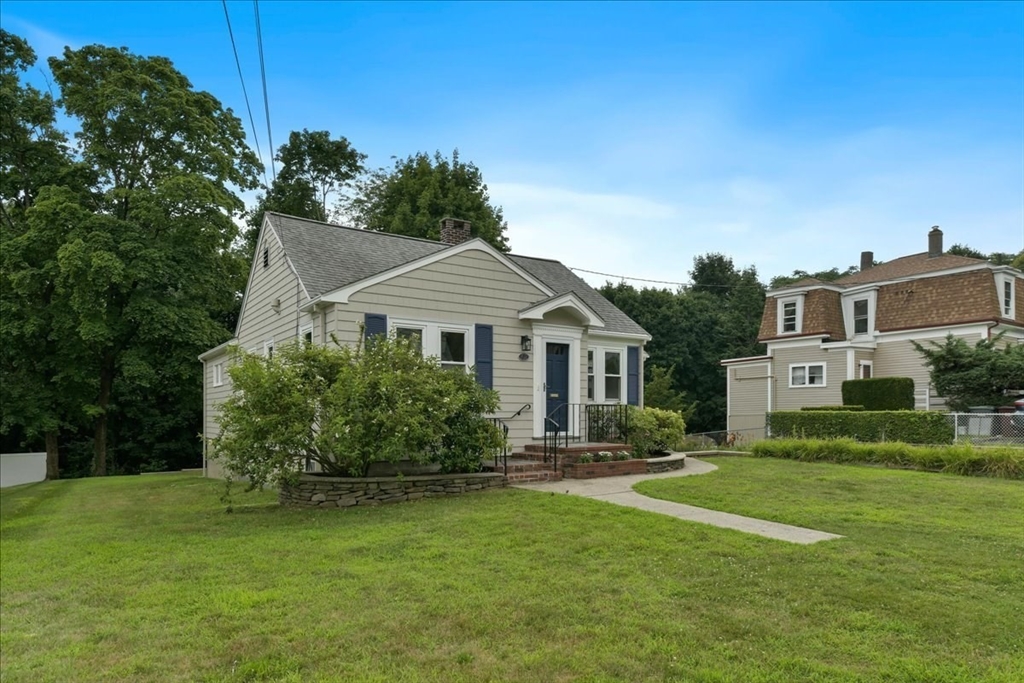 102 Border Street Dedham, MA 02026 - Photo 32 of 34 a front view of a house with a garden