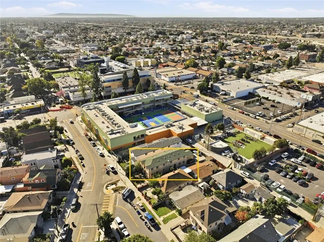 an aerial view of residential building with parking space