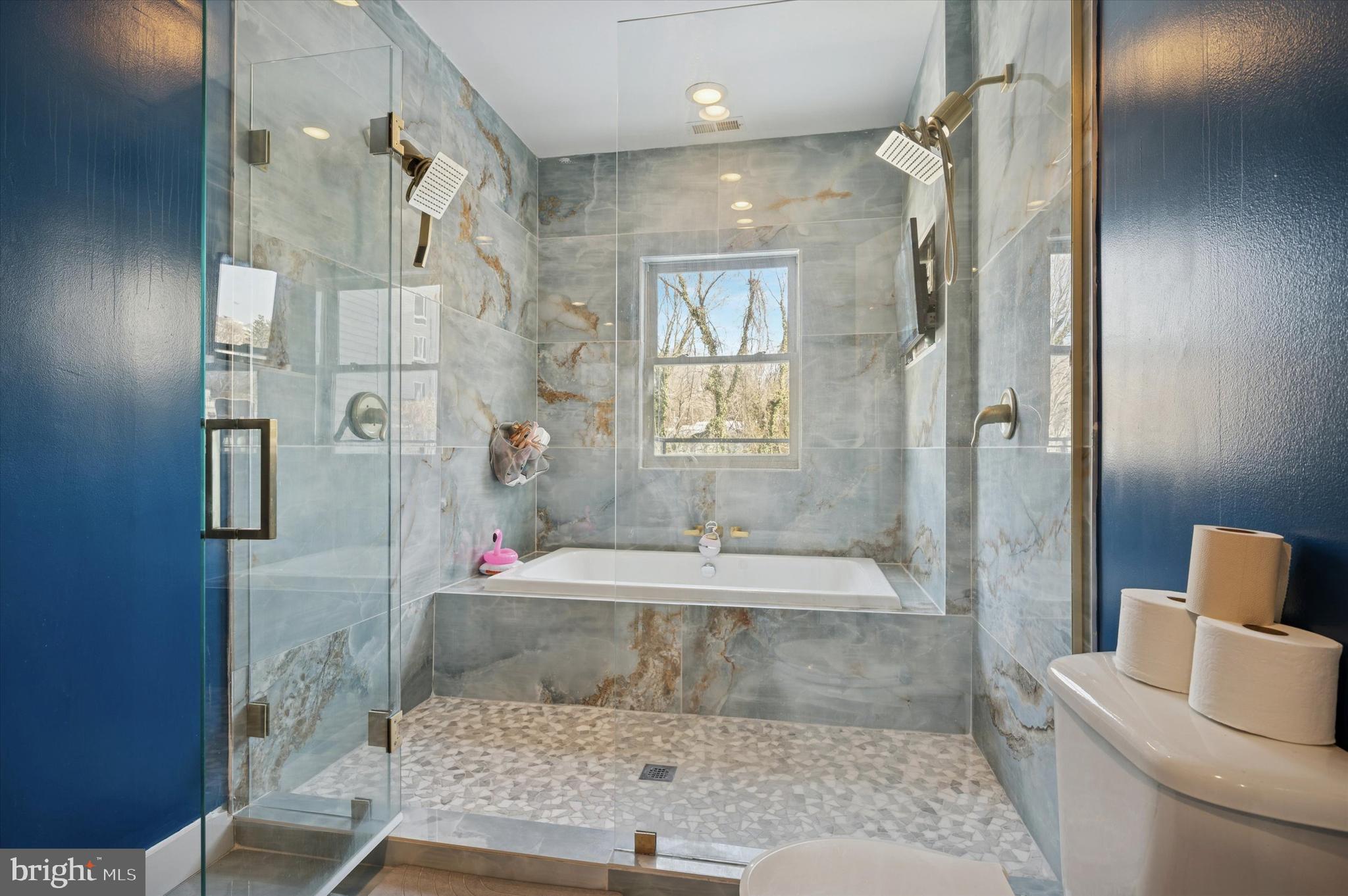 4743 Sheldon Street Philadelphia, PA 19127 - Photo 17 of 18 a bathroom with a granite countertop sink a toilet and shower