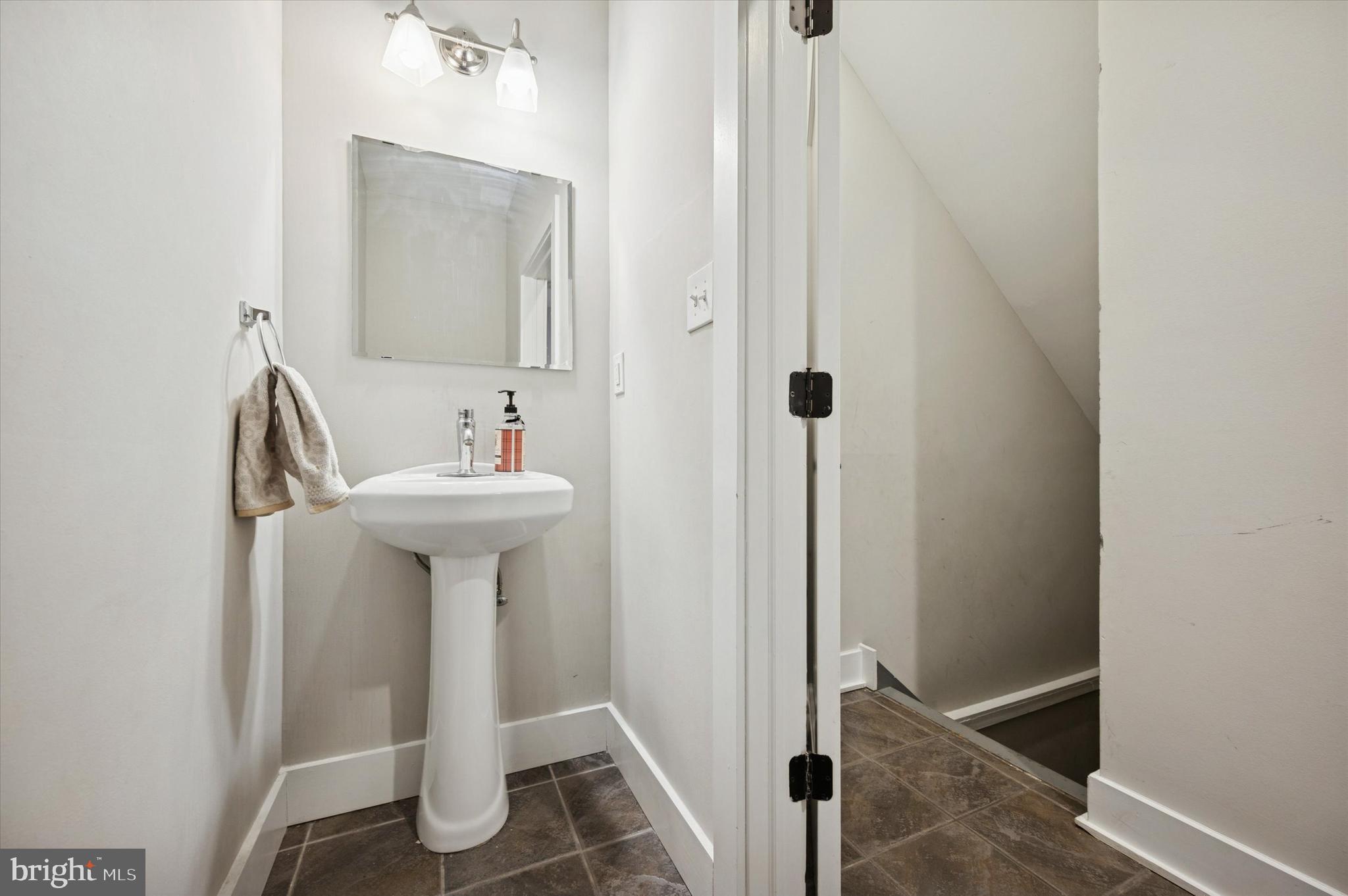 4743 Sheldon Street Philadelphia, PA 19127 - Photo 3 of 18 a bathroom with a sink and a mirror