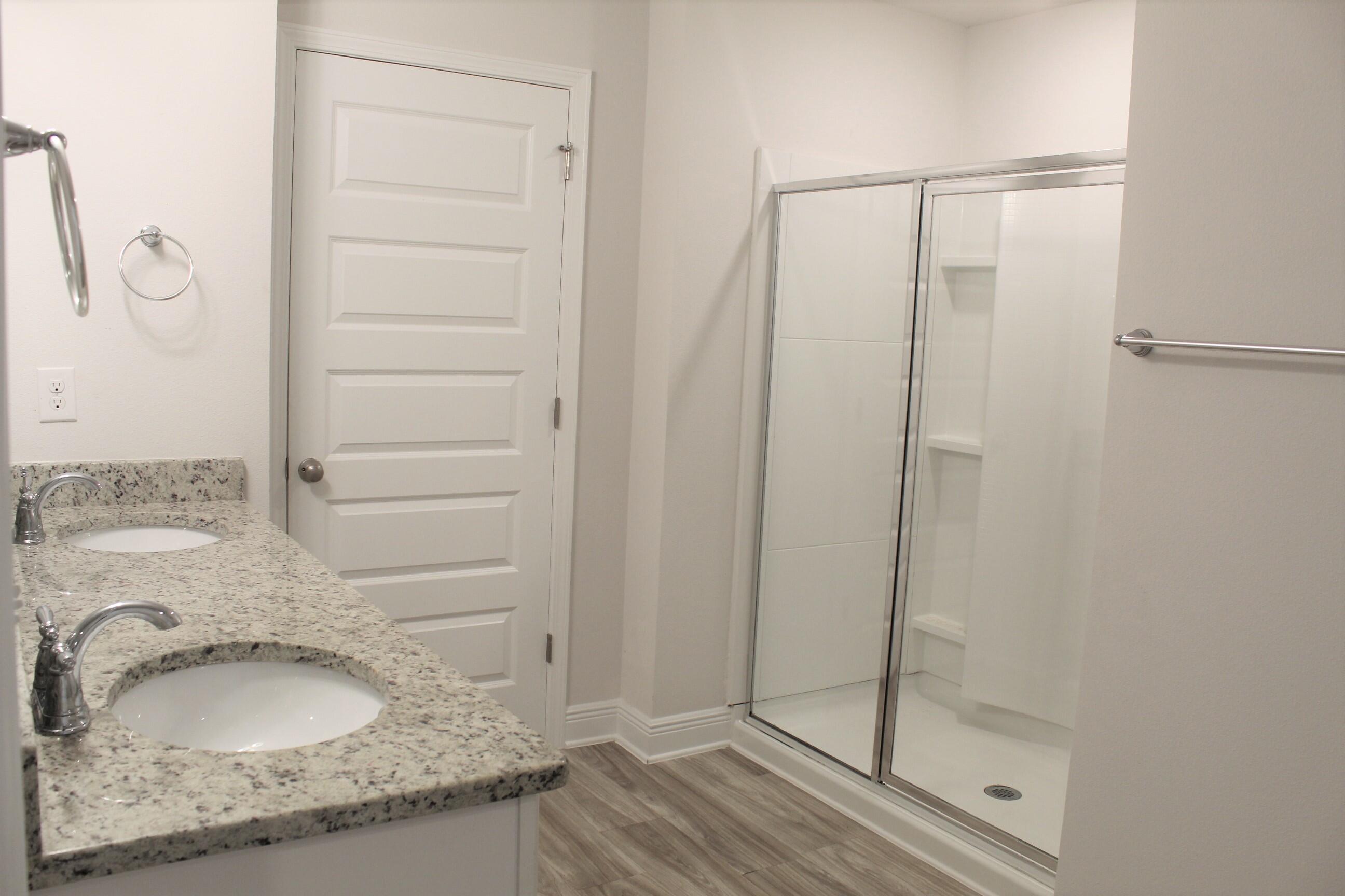 3139 Heritage Oaks Circle Navarre, FL 32566 - Photo 18 of 34 a bathroom with a granite countertop sink and a mirror