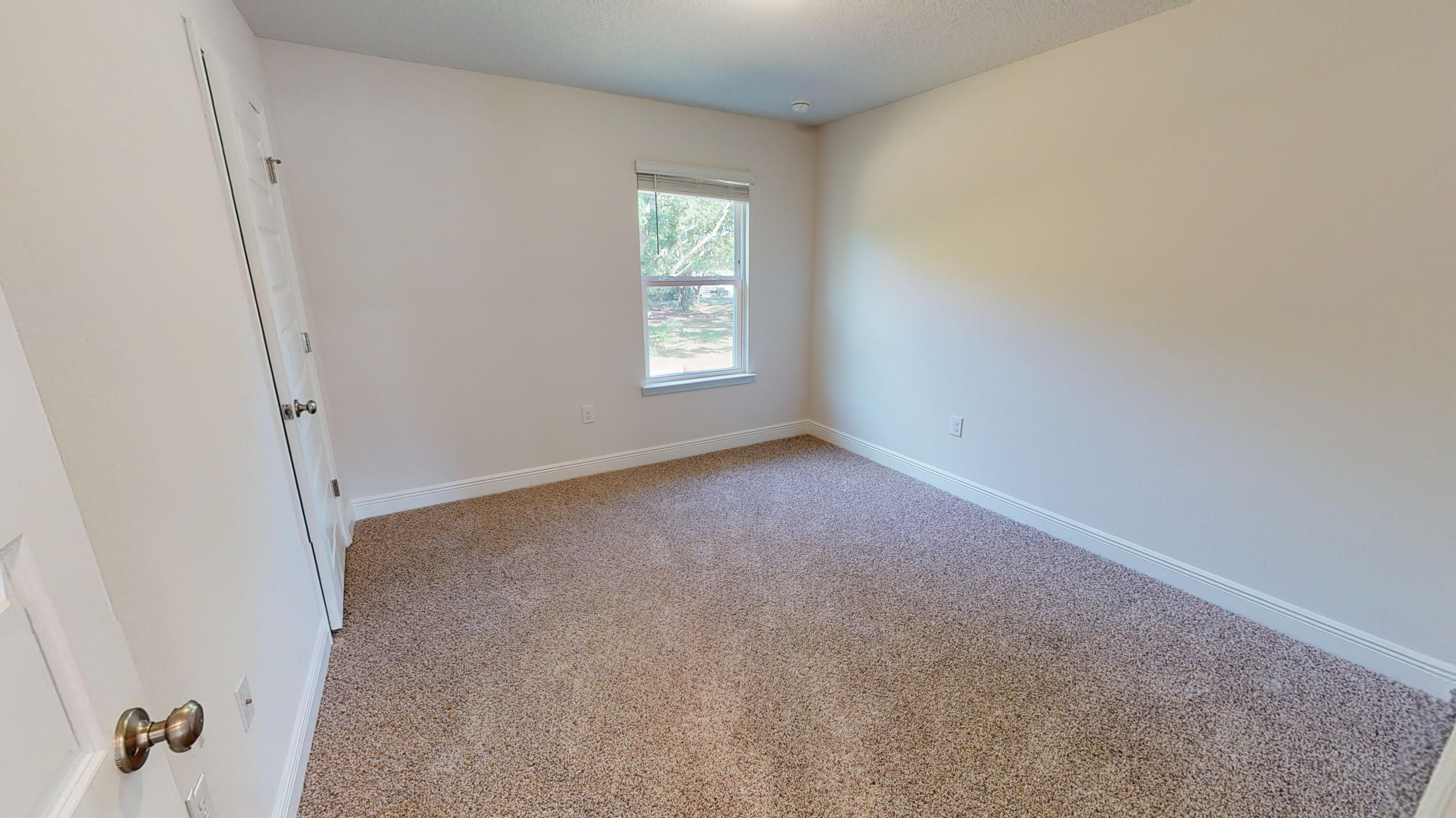 3139 Heritage Oaks Circle Navarre, FL 32566 - Photo 22 of 34 an empty room with a window