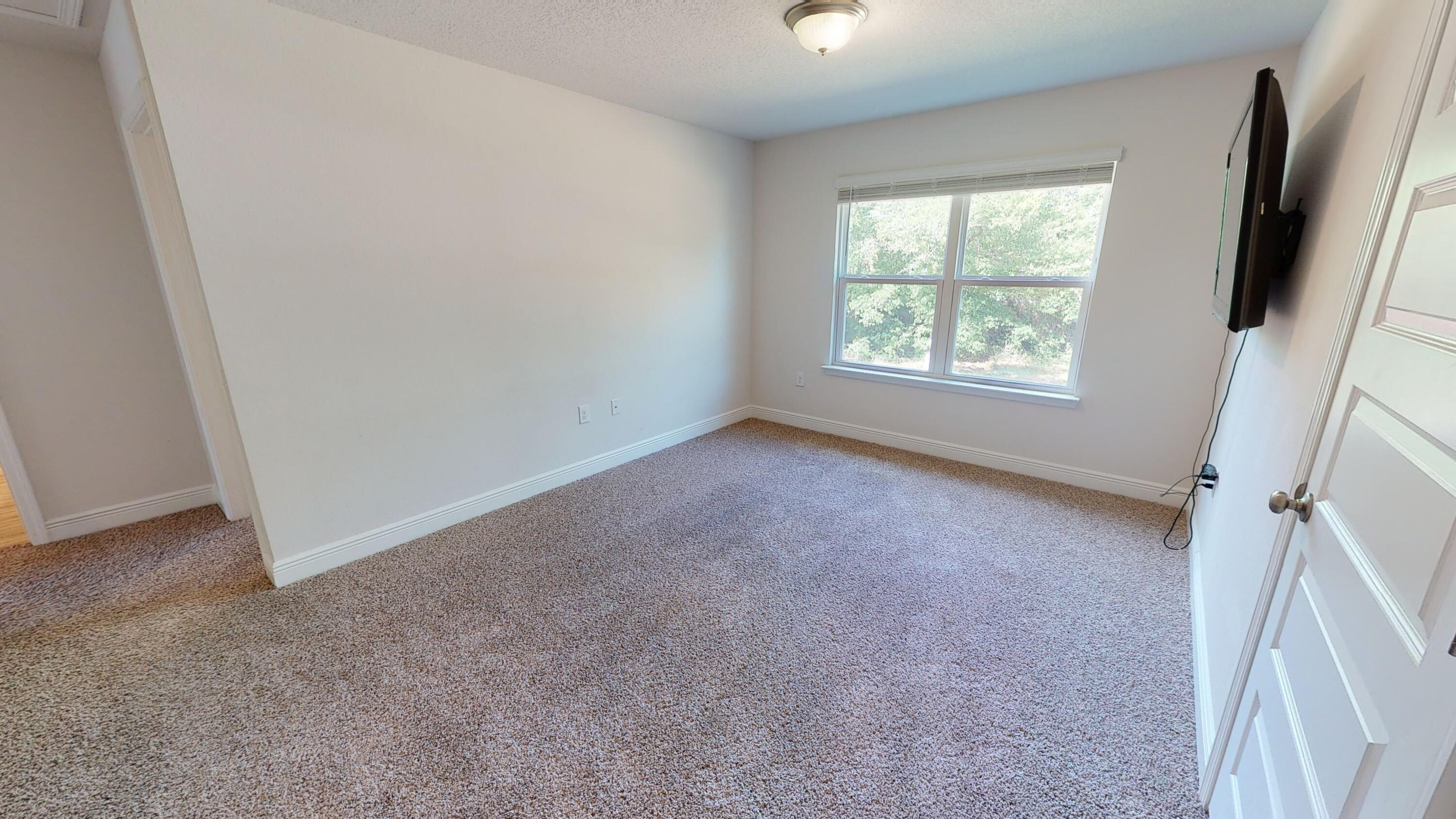 3139 Heritage Oaks Circle Navarre, FL 32566 - Photo 23 of 34 an empty room with windows