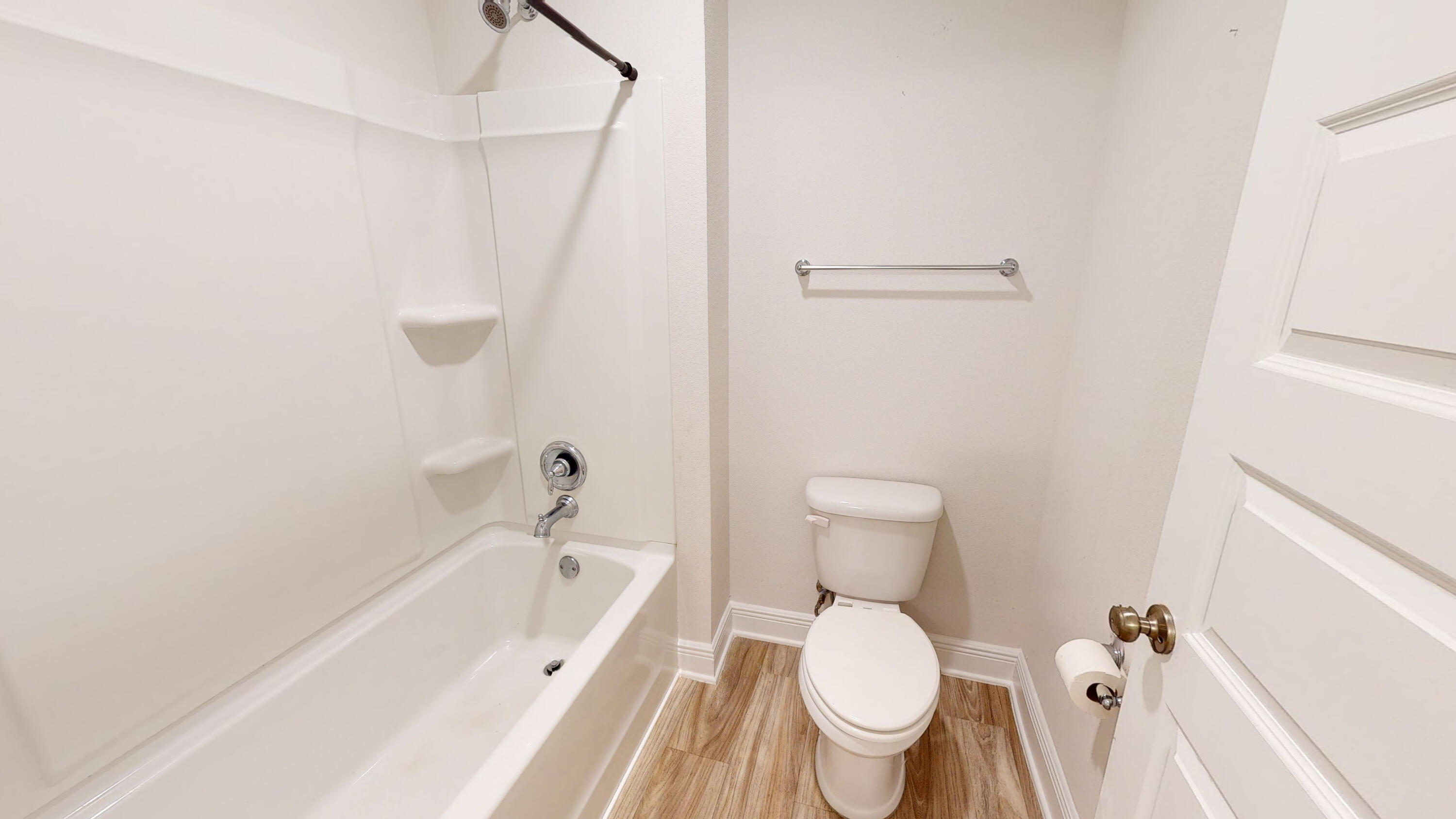 3139 Heritage Oaks Circle Navarre, FL 32566 - Photo 25 of 34 a bathroom with a toilet and a bathtub