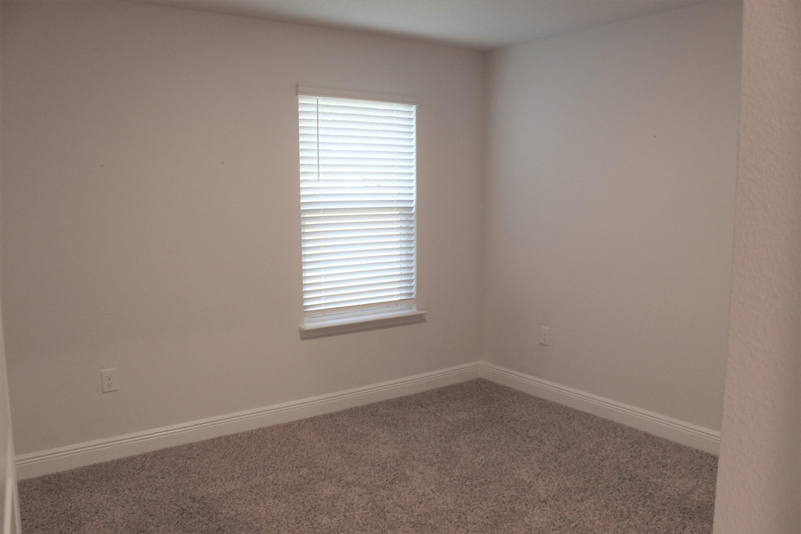 3139 Heritage Oaks Circle Navarre, FL 32566 - Photo 30 of 34 an empty room with a window