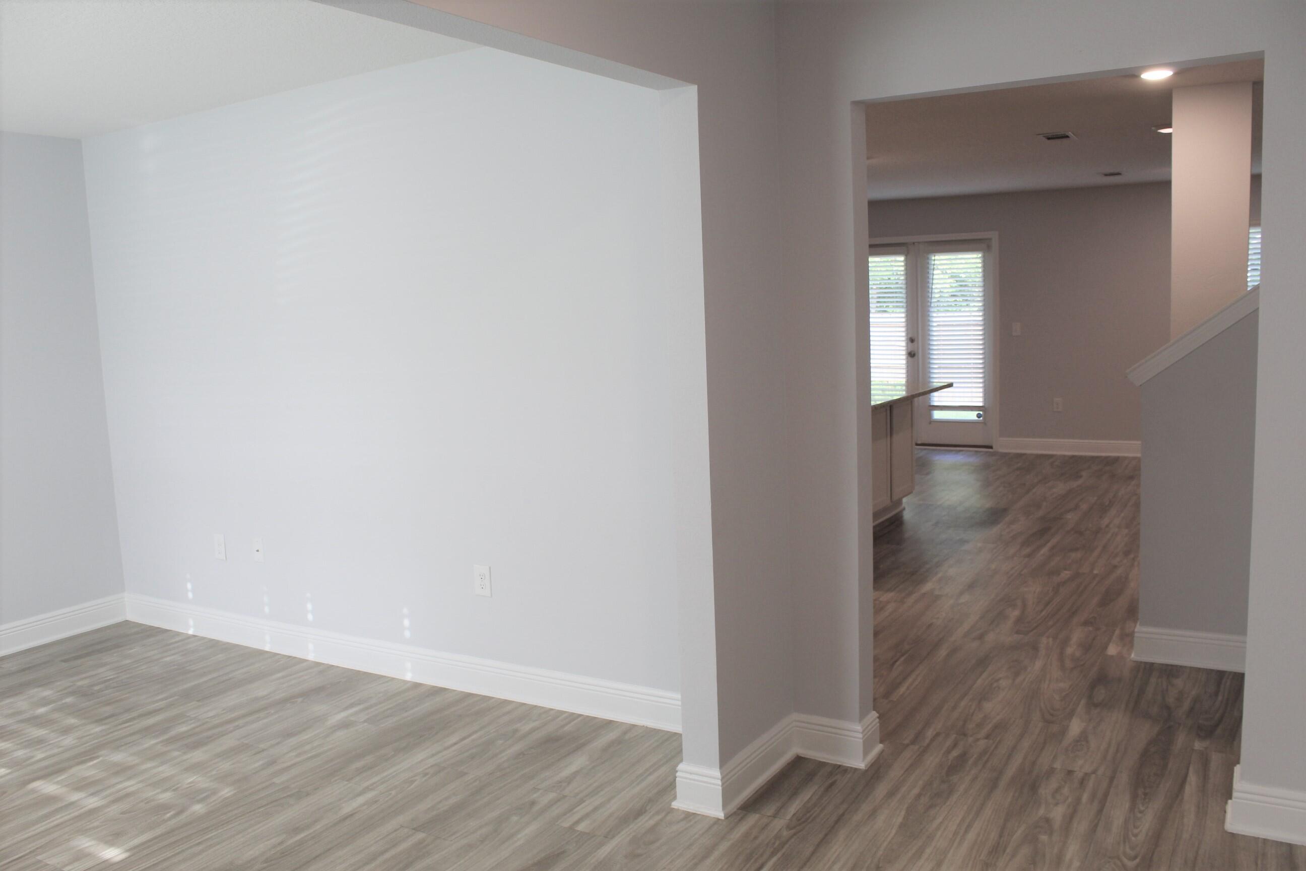 3139 Heritage Oaks Circle Navarre, FL 32566 - Photo 4 of 34 a view of empty room with wooden floor
