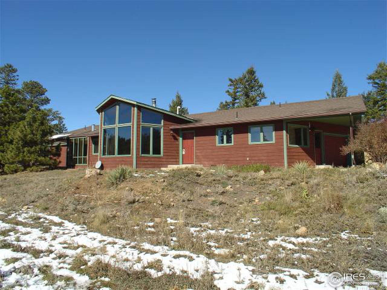 773 Sky Trail Road Boulder, CO 80302 - Photo 1 of 18 a front view of a house with a yard