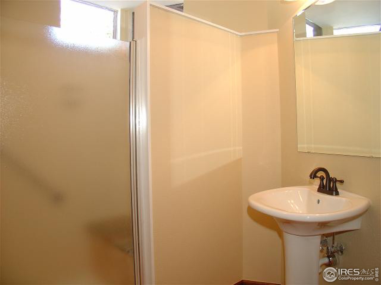 773 Sky Trail Road Boulder, CO 80302 - Photo 15 of 18 a bathroom with a sink and mirror