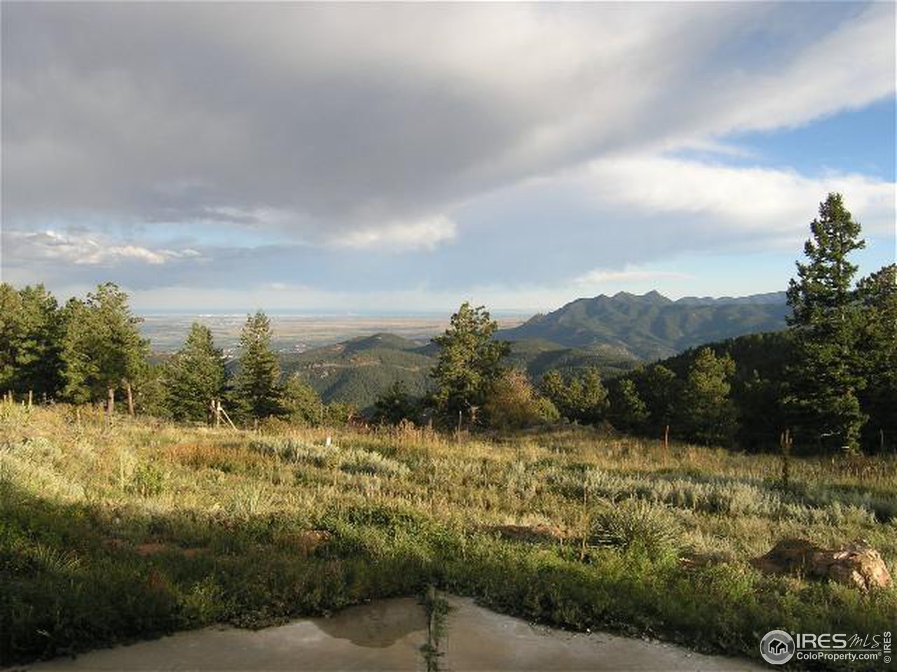 773 Sky Trail Road Boulder, CO 80302 - Photo 2 of 18 a view of a yard with mountains in the background