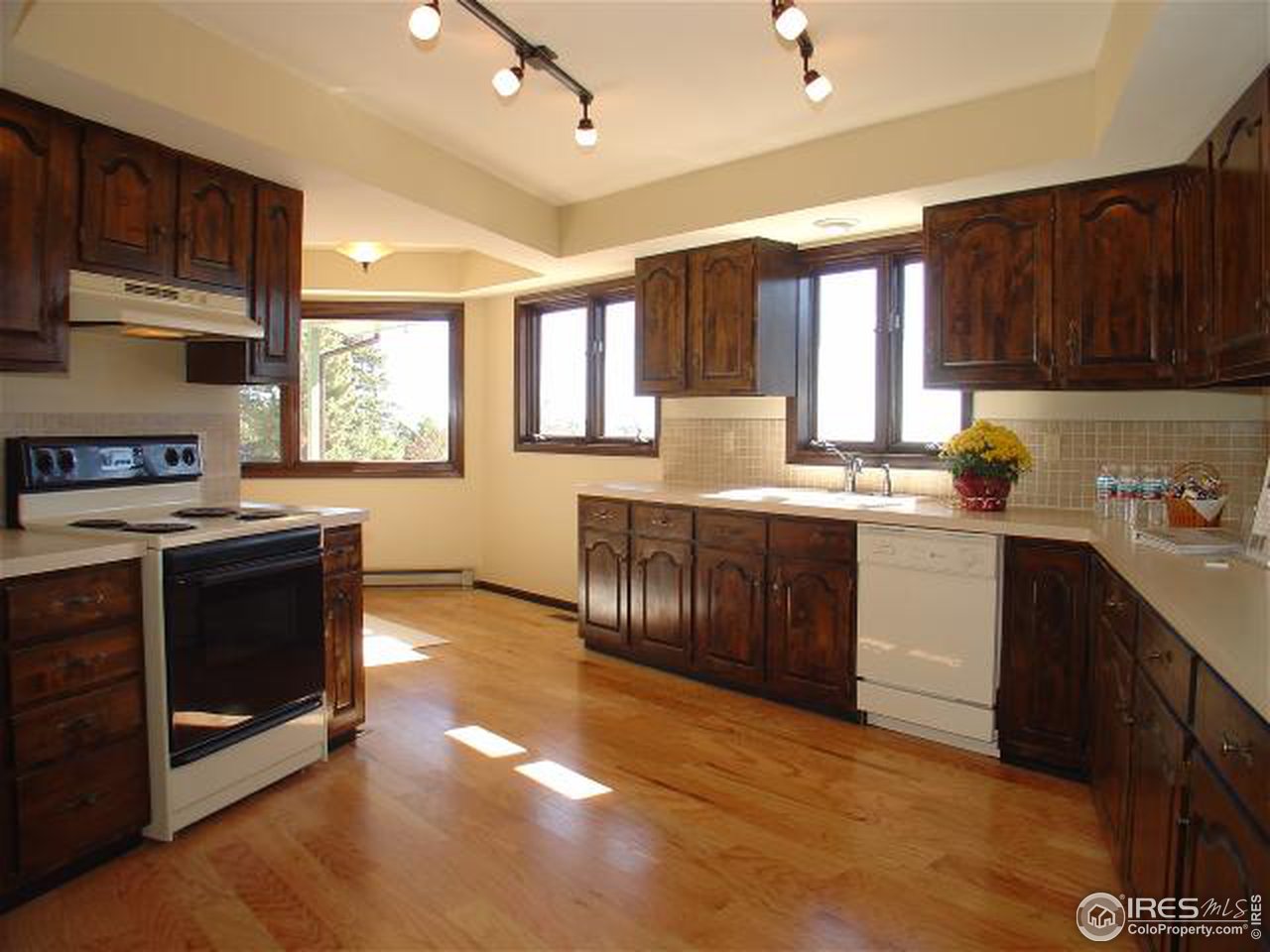 773 Sky Trail Road Boulder, CO 80302 - Photo 4 of 18 a kitchen with stainless steel appliances granite countertop a stove a sink dishwasher and a microwave oven with cabinets