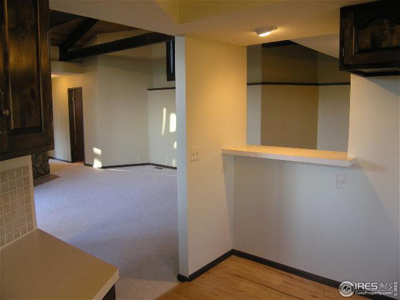 773 Sky Trail Road Boulder, CO 80302 - Photo 10 of 18 a view of empty room with wooden floor