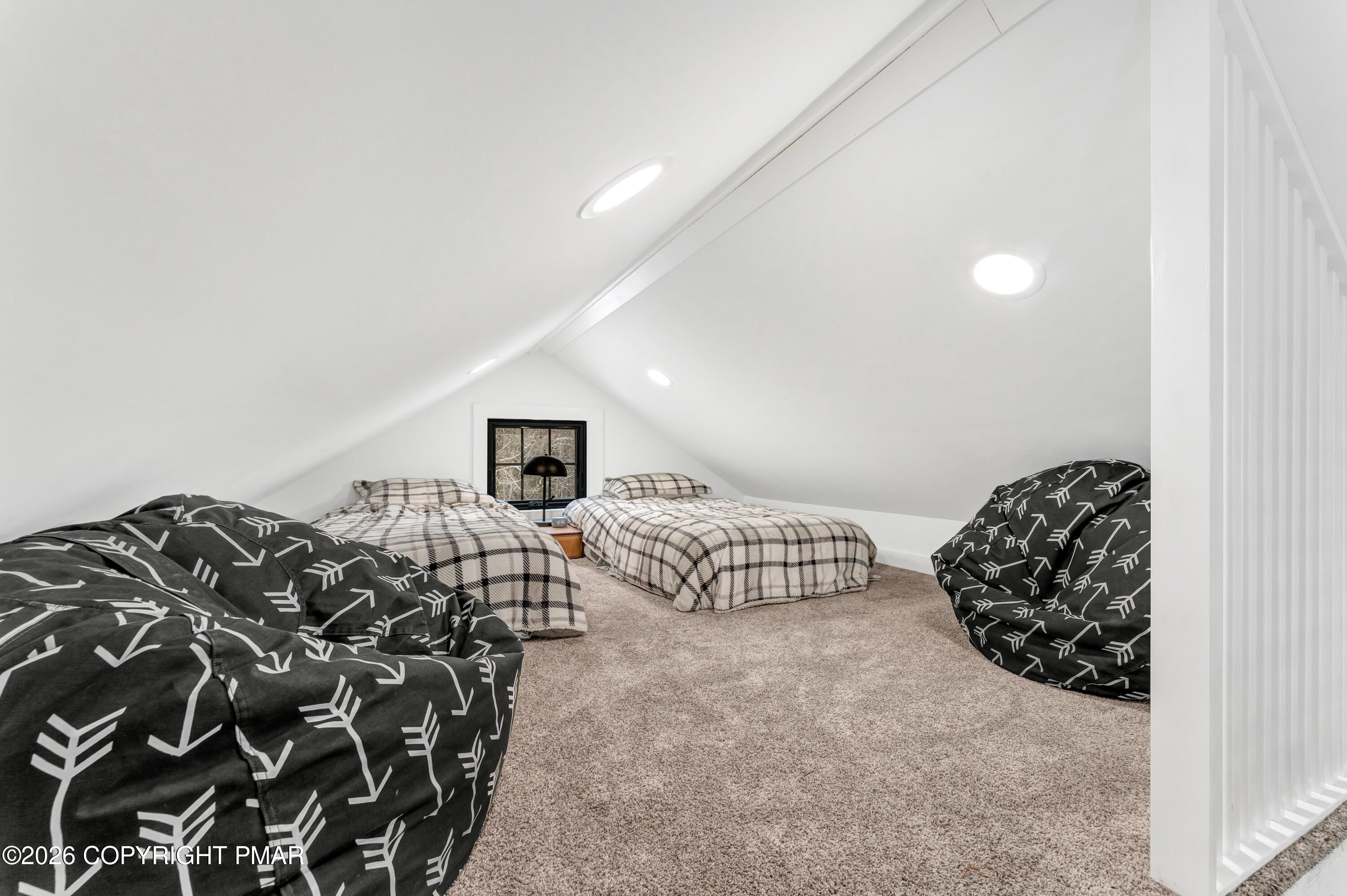 353 German Hill Road Shohola, PA 18458 - Photo 20 of 35 a bedroom with a bed and a chair