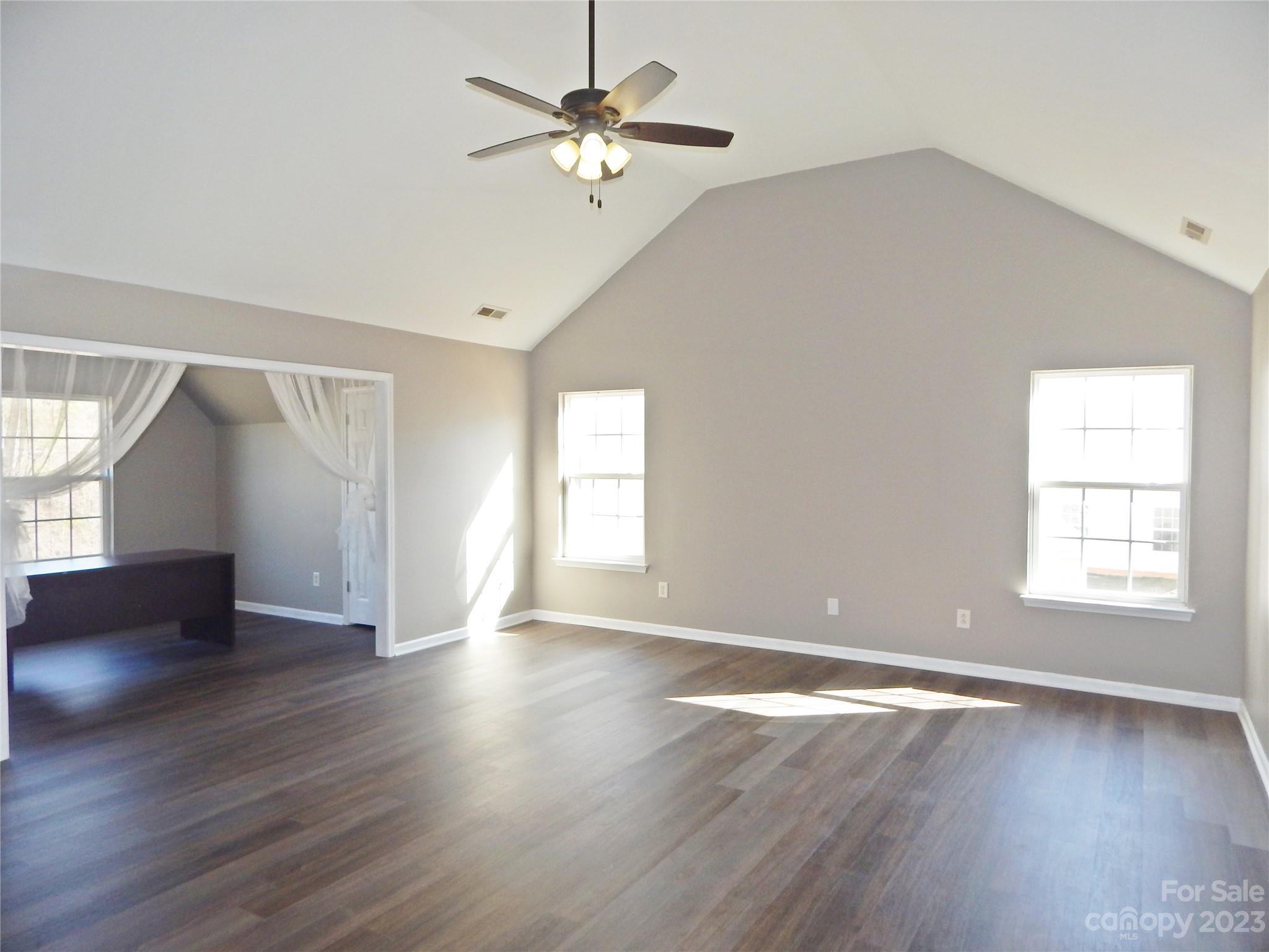 651 Fall Line Way Rock Hill, SC 29730 - Photo 13 of 25 a view of an empty room with wooden floor and a window