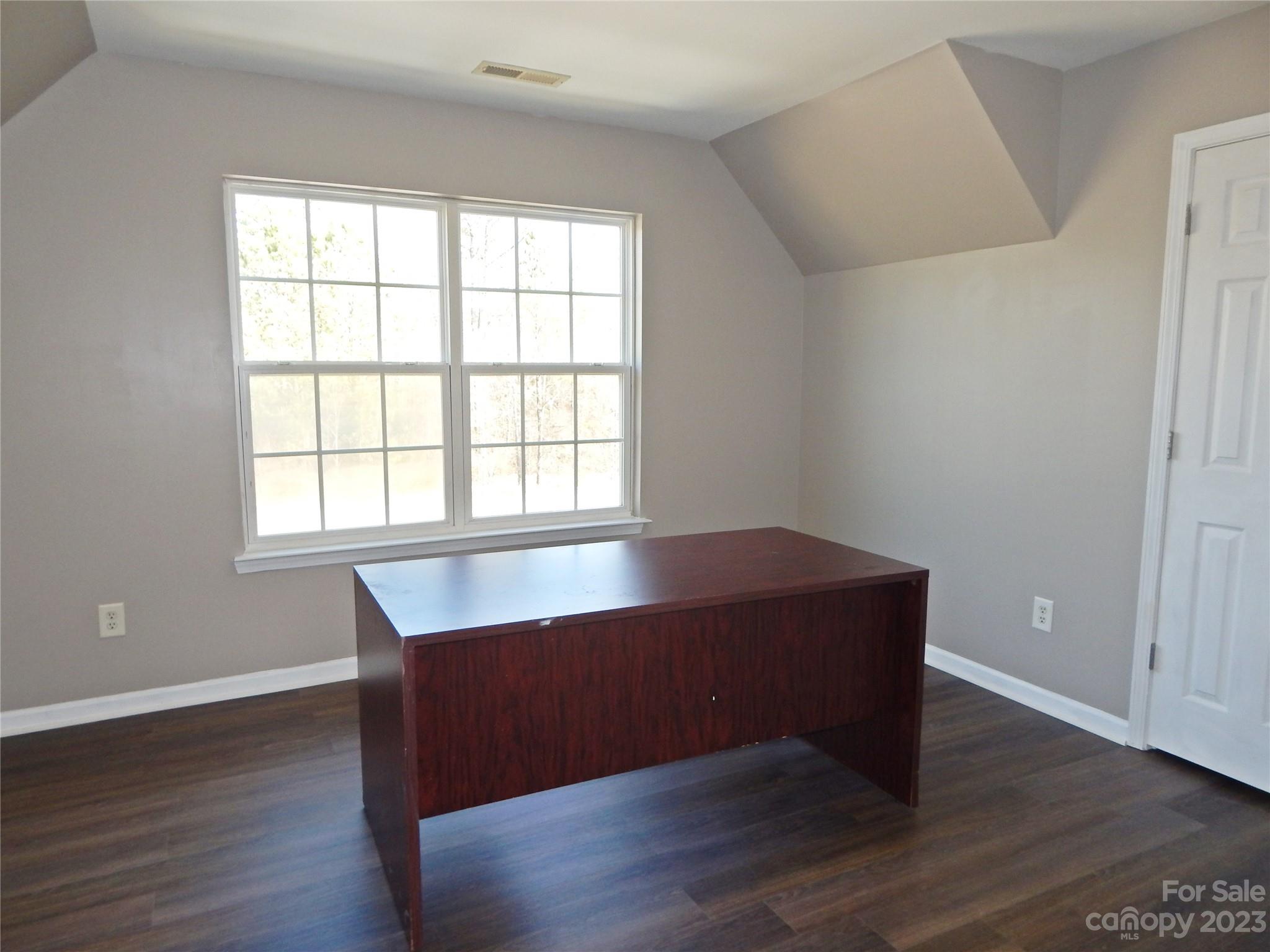 651 Fall Line Way Rock Hill, SC 29730 - Photo 16 of 25 an empty room with wooden floor and windows