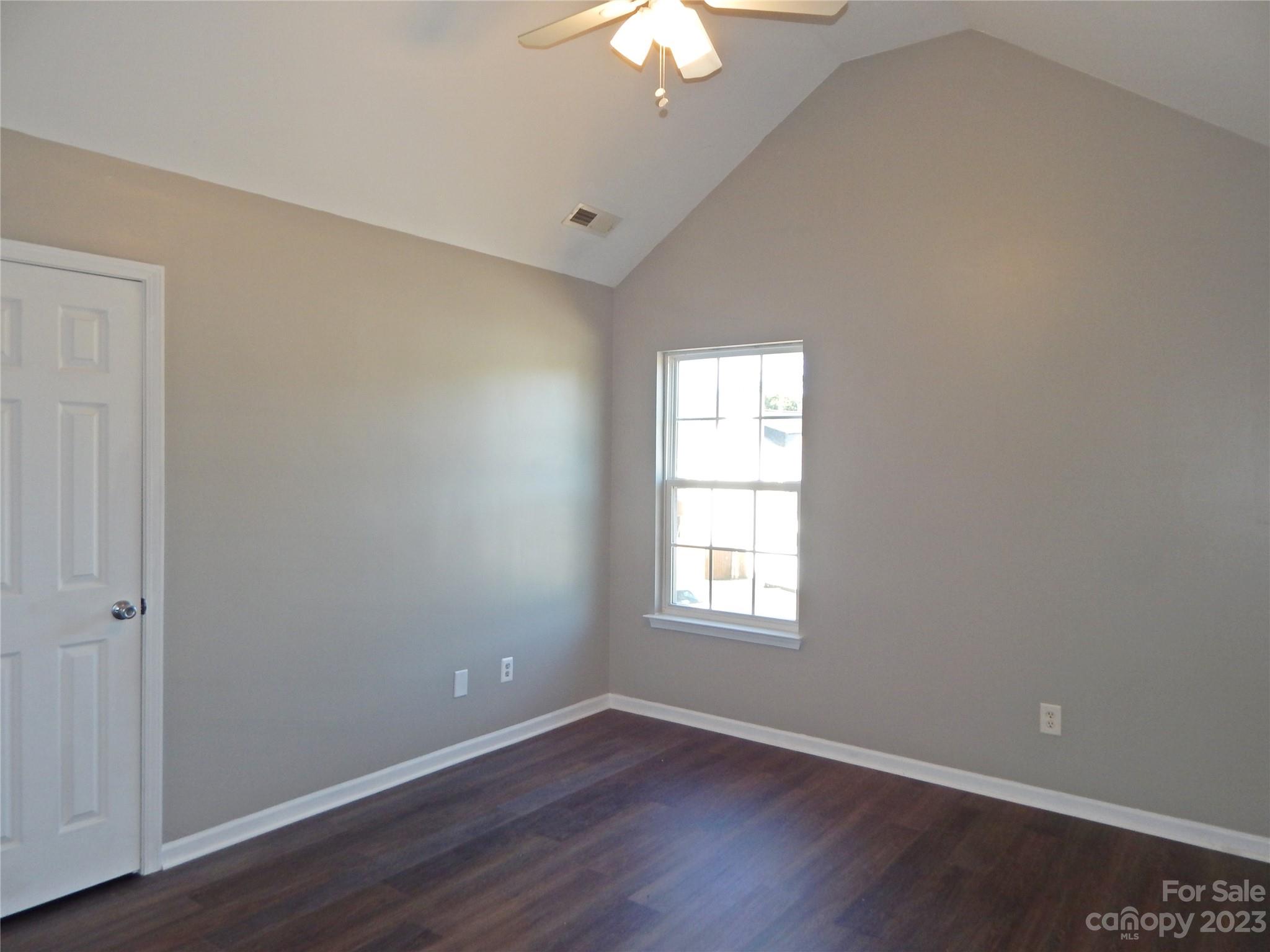 651 Fall Line Way Rock Hill, SC 29730 - Photo 21 of 25 an empty room with wooden floor and windows