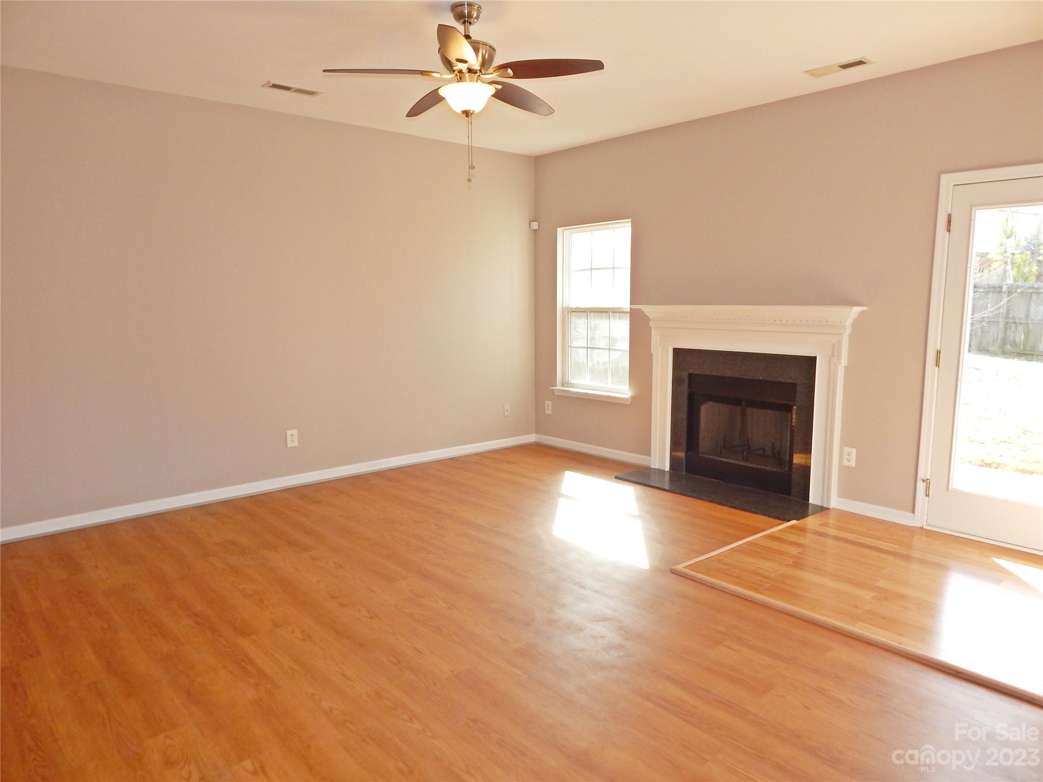 651 Fall Line Way Rock Hill, SC 29730 - Photo 7 of 25 an empty room with windows fireplace and a sink