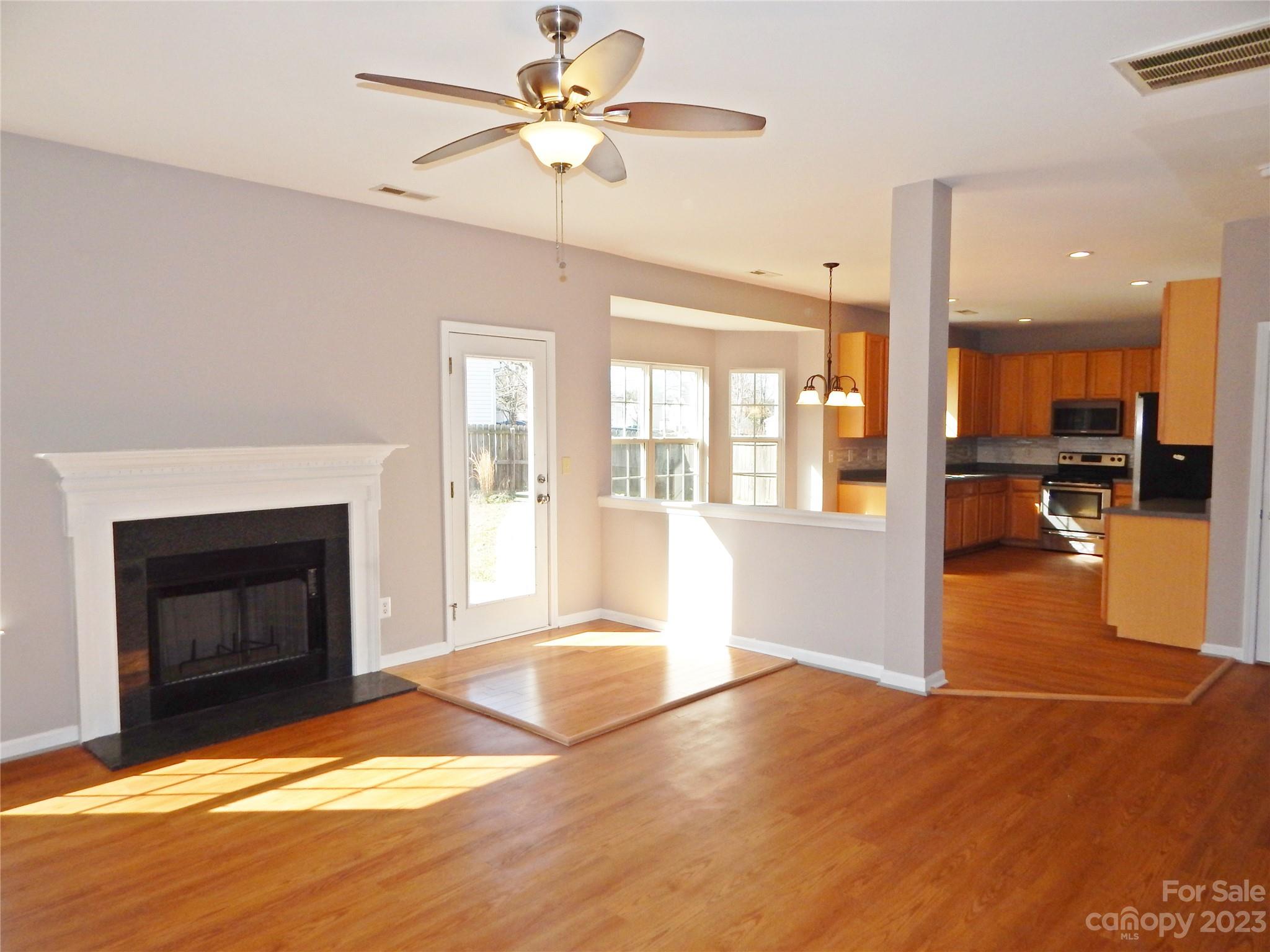 651 Fall Line Way Rock Hill, SC 29730 - Photo 8 of 25 a view of an empty room with a fireplace and a window