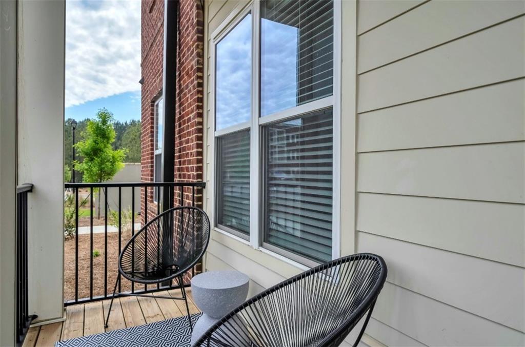 300 Prominence Point Parkway, Unit 1312 Canton, GA 30114 - Photo 15 of 25 a view of balcony with wooden floor