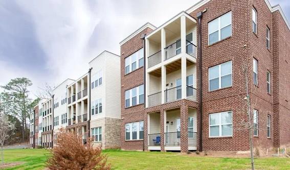 300 Prominence Point Parkway, Unit 1312 Canton, GA 30114 - Photo 17 of 25 a view of a building with a yard