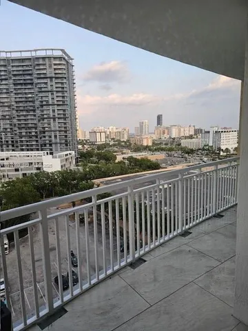 a view of a balcony with city view